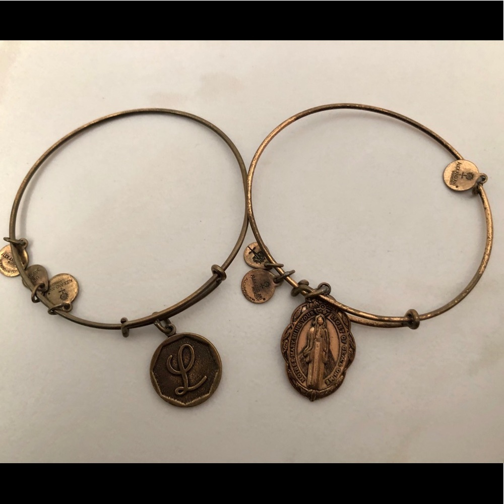 Two Alex and Ani gold bracelets.